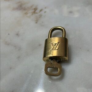 Louis Vuitton Gold Padlock with brass Unpolished